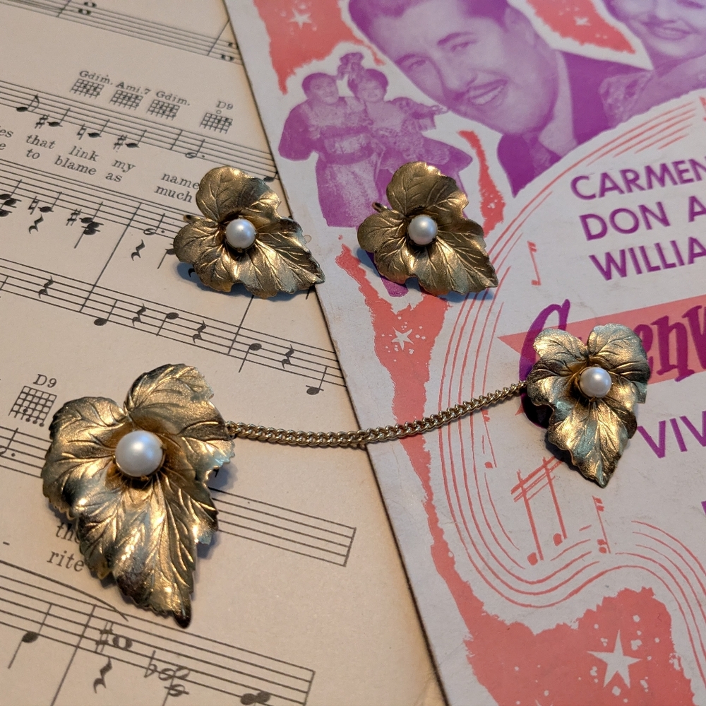 Vintage sweater clip set with matching earrings.